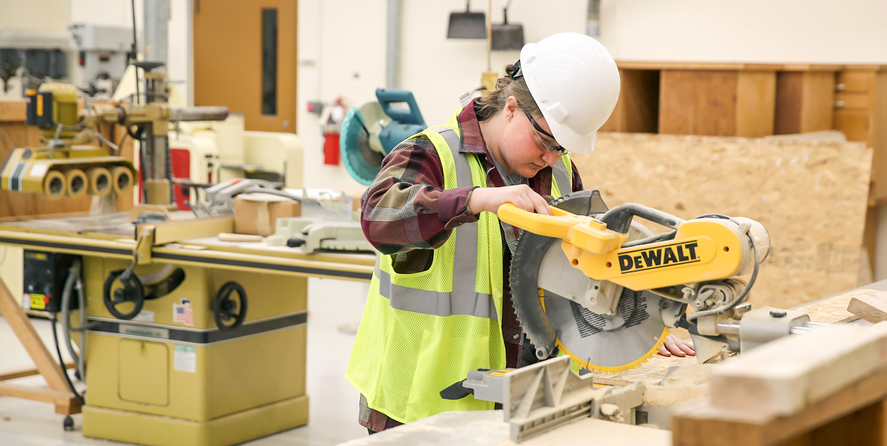 UW-Stout student uses table saw in the construction lab
