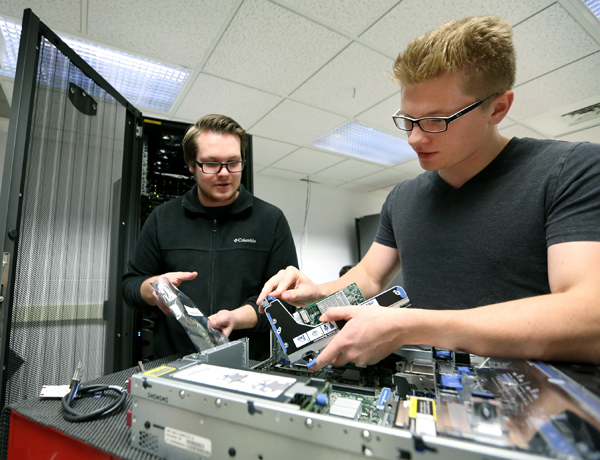 Students work in a computer networking and information technology lab at UW-Stout.