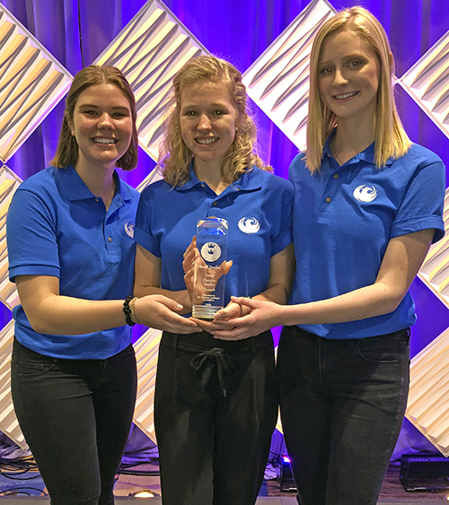 Team members left to right, Mia Bartel, Abbegail Lee and Bridget Johnson after receiving the Phoenix Challenge Competition award  in New Orleans