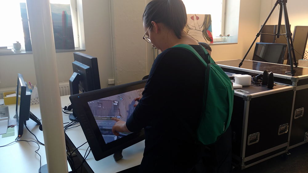 UW-Stout student Leslie Murphy works on a touch screen program at Rise Interactive.