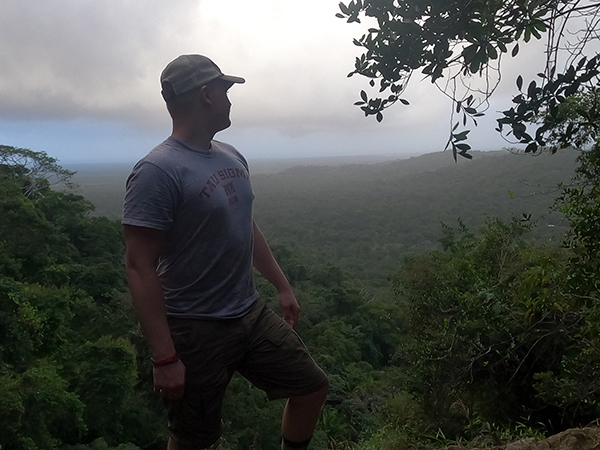 Chris Jones enjoys a scenic overlook in January in Belize while taking the UW-Stout Winterm course Natural History of the Neotropics.