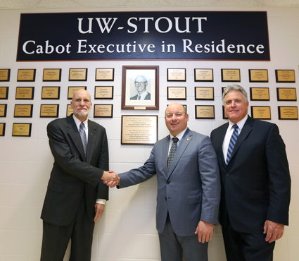  From left, Scott Cabot, Todd Wanek and Chancellor Bob Meyer gather at the Cabot Executive in Residence Wall of Honor at UW-Stout.