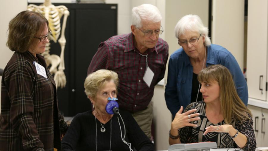 UW-Stout Associate Professor Kerry Peterson, front right, explains food pathogens during a demonstration at the 2016 Stout Summit.