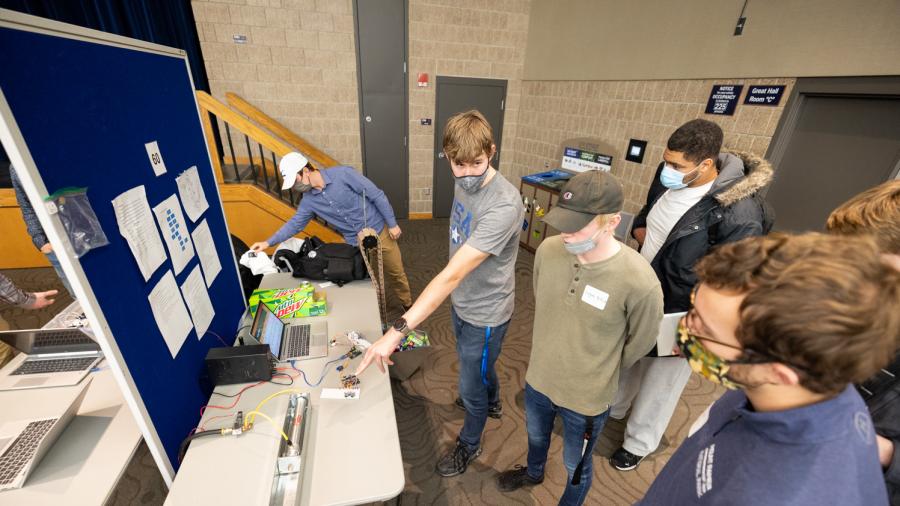 To encourage sustainability, students created an automatic, high-capacity can crusher model that they shared at the expo.