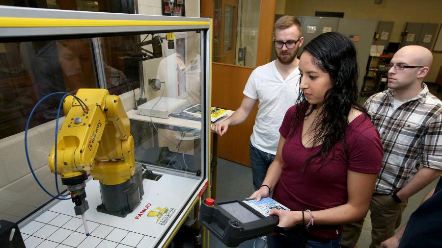Students program a robot in a UW-Stout engineering lab.