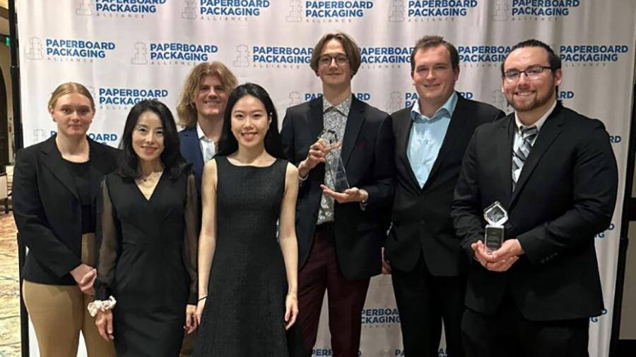 UW-Stout students gather with Assistant Professor Kate Liu, second from left, and their awards at the PPA event in San Diego. They are, from left, Erika Jackett, Zach Hoffmire, Starr Gong, Ethan Myers, Lukas David and Buddy Moreno.