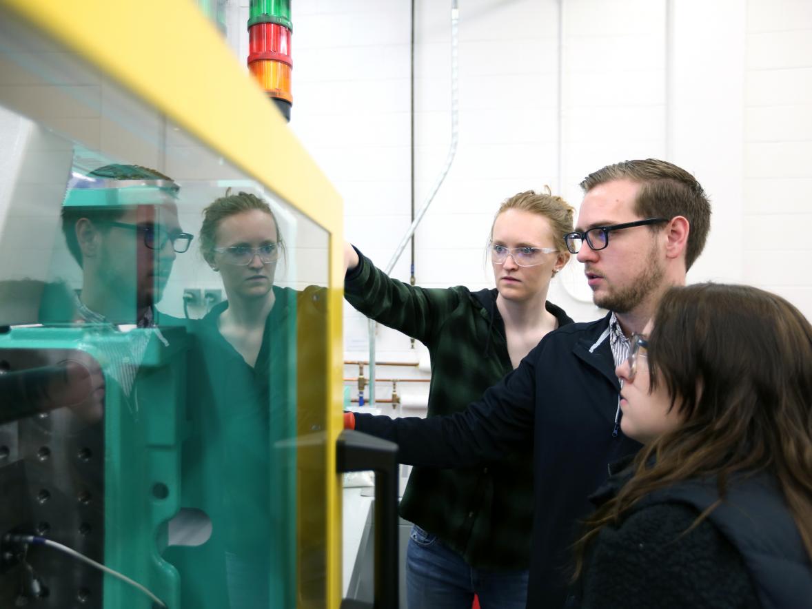 From left, students Natalie Deeg, Thomas Hirsch and Rebecca O’Brien work in the plastics engineering lab at UW-Stout.