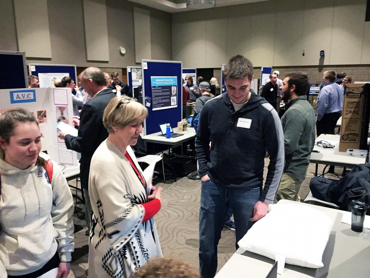 UW-Stout first-year student Ben Uitenbroek explains the design of a Bluetooth pillow alarm to Mary Spaeth, assistant professor of business./UW-Stout photos by Pam Powers