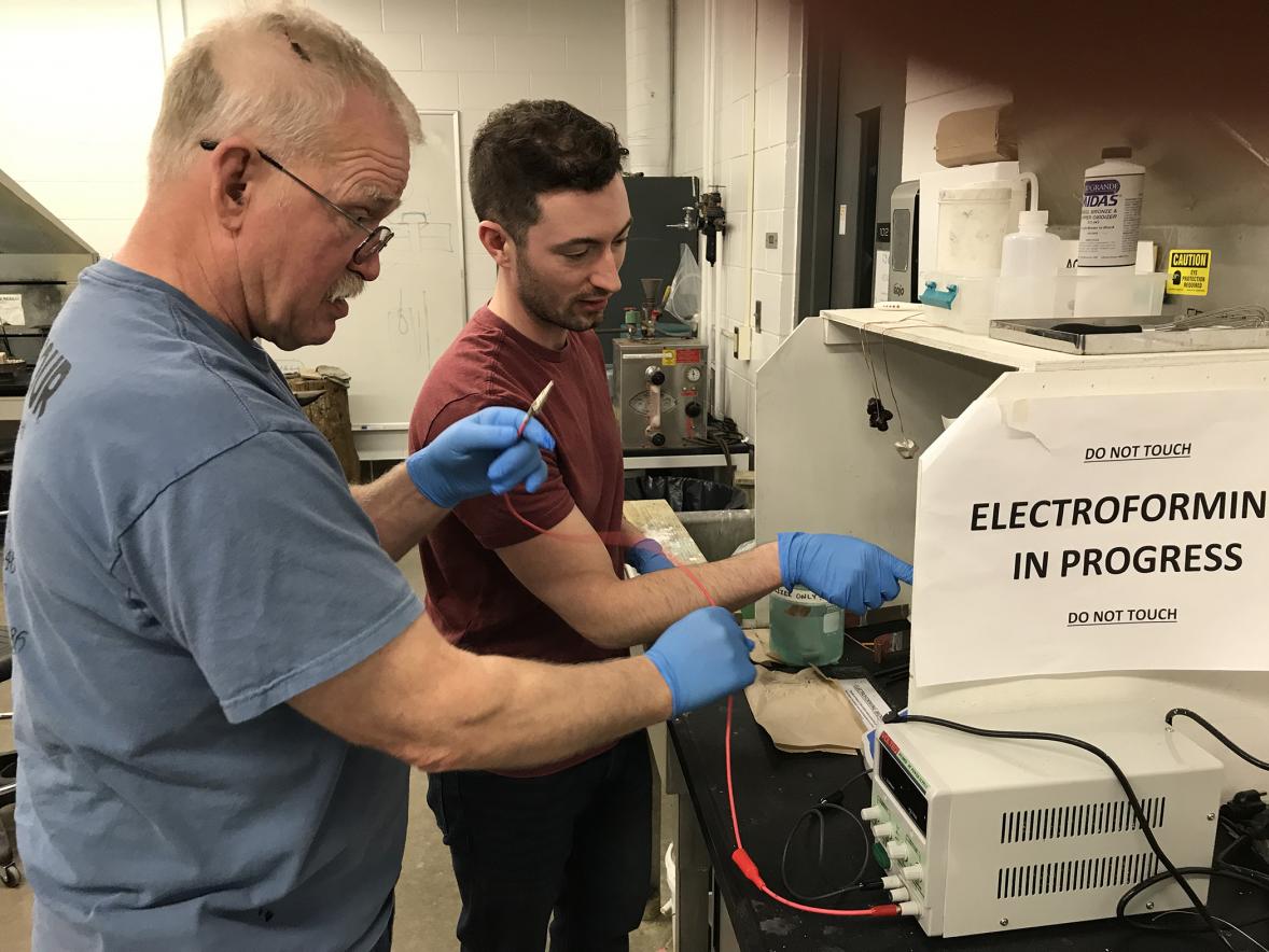 Arne Thompson, left, works on electroforming in a lab with Assistant Professor Vincent Pontillo-Verrastro.