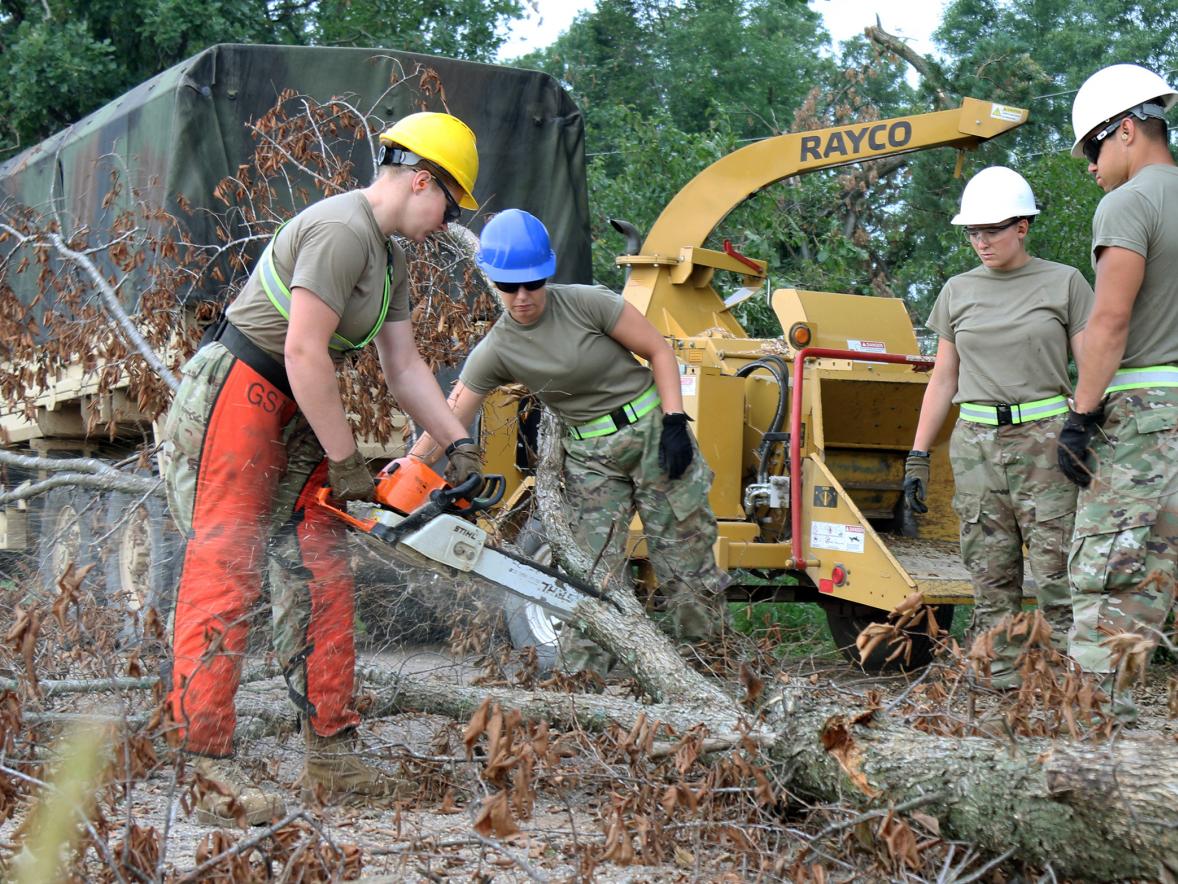 Alysha Stieber, second from left, helps with storm cleanup this summer in northern Wisconsin as part of the Wisconsin National Guard.