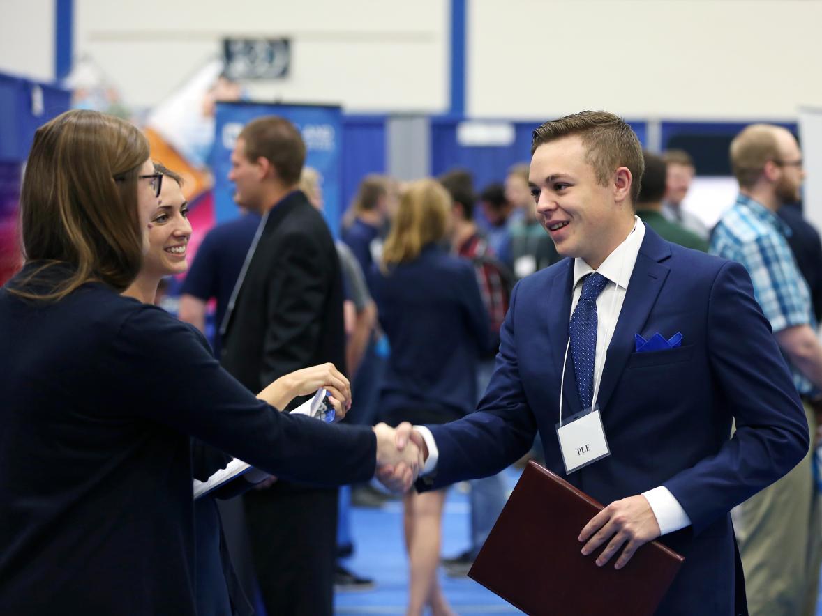 A student, right, meets with a company recruiter during the 2018 Fall Career Conference. / UW-Stout photo