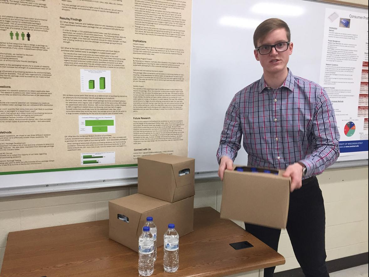 UW-Stout packaging student Ben Cram talks about a paperboard case for bottled water that appeals to upscale customers for its sustainability over plastic shrink wrap.