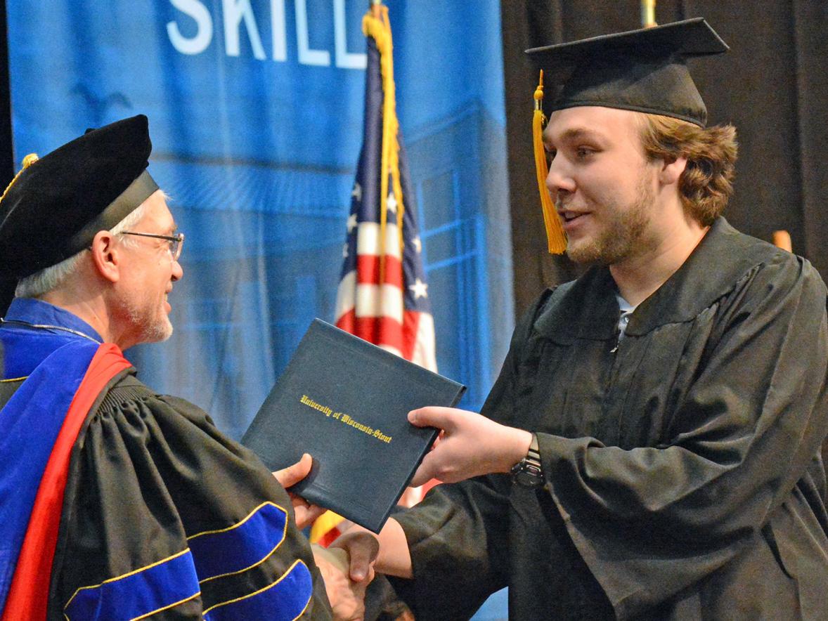 Taylor Thomas receives his diploma Dec. 14.