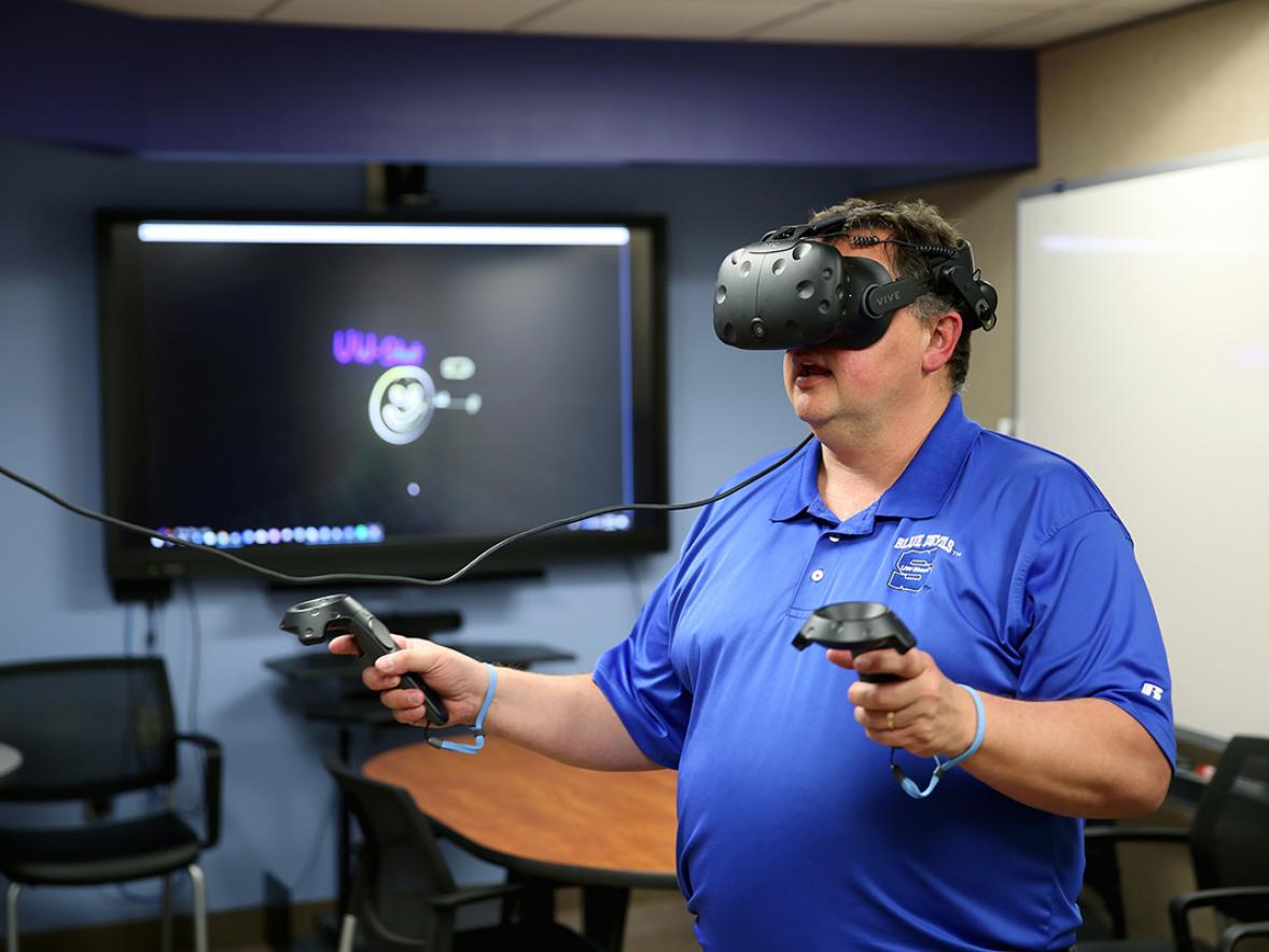 Kevin W. Tharp using virtual reality technology.