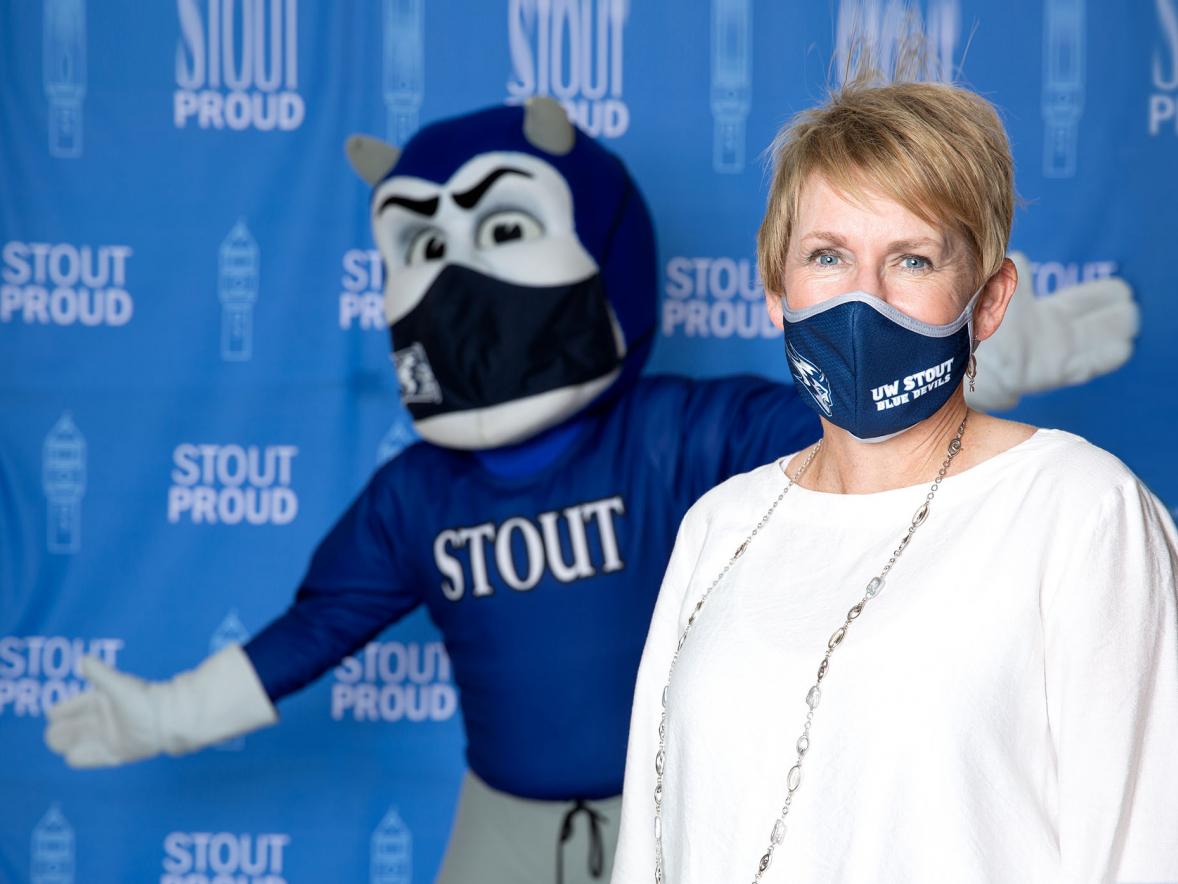 Photo of Chancellor Katherine P. Frank and Blaze wearing masks.