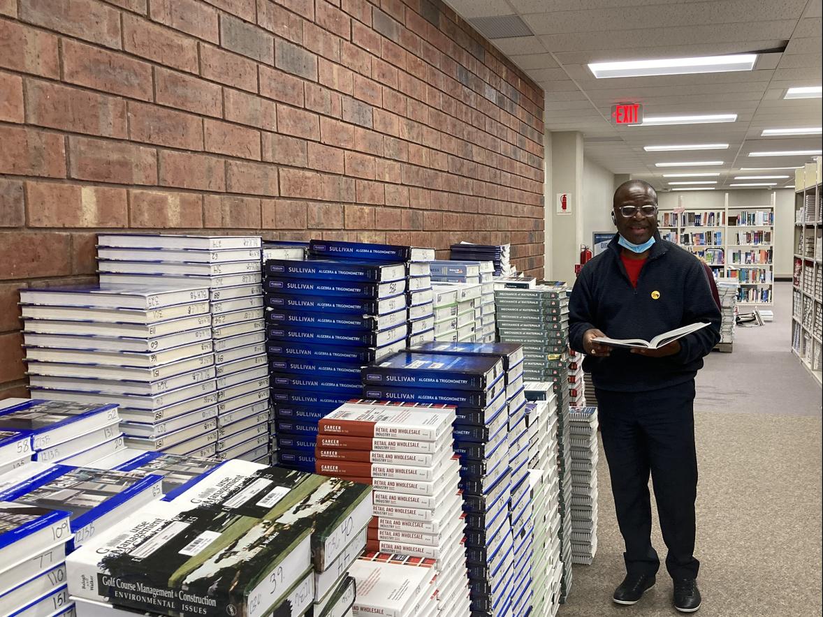Assistant Professor Mike Essien, president-elect of Books for Africa, is grateful for the donation of more than 12,500 textbooks for the organization from the University Library Instructional Resources Center./UW-Stout photo by Pam Powers