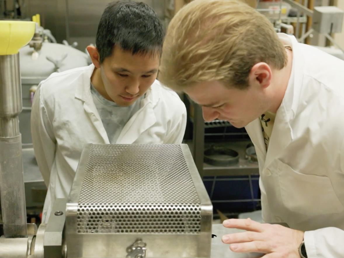 Joshua Bernin and Luke Bickelhaupt work with the extruder in the Food Process Engineering Research Lab.