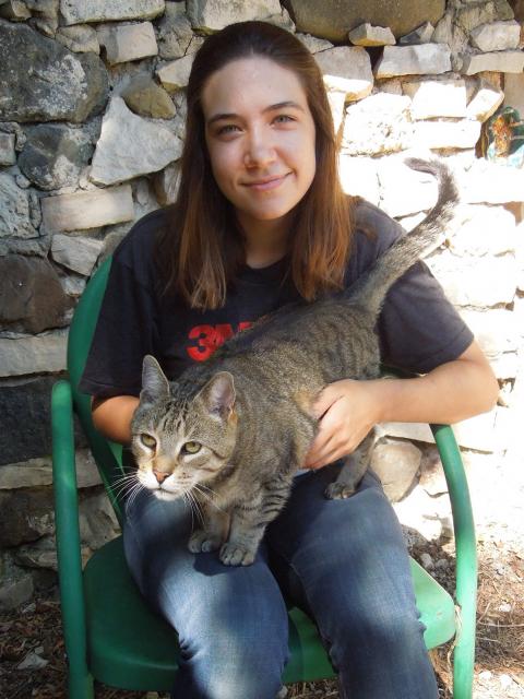 Mary Benetti, game design and development senior, with her cat at her home in Pewaukee.