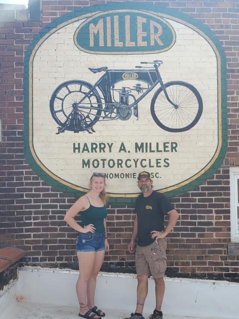 Wade Lambrigtsen and his student intern at the Harry Miller mural on the Keane building, downtown Menomonie.