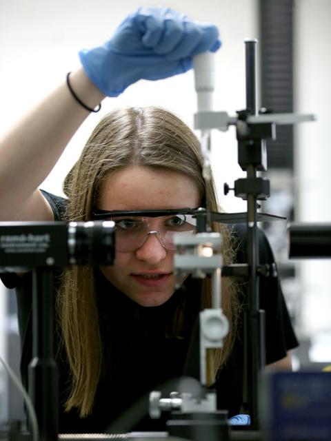 A student works in a packaging lab at UW-Stout during Min DeGruson’s Packaging Material: Polymers and Glass course.