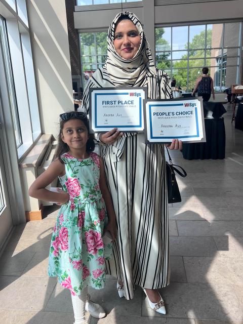 Areeba Ali with her daughter at WiSys SPARK Symposium